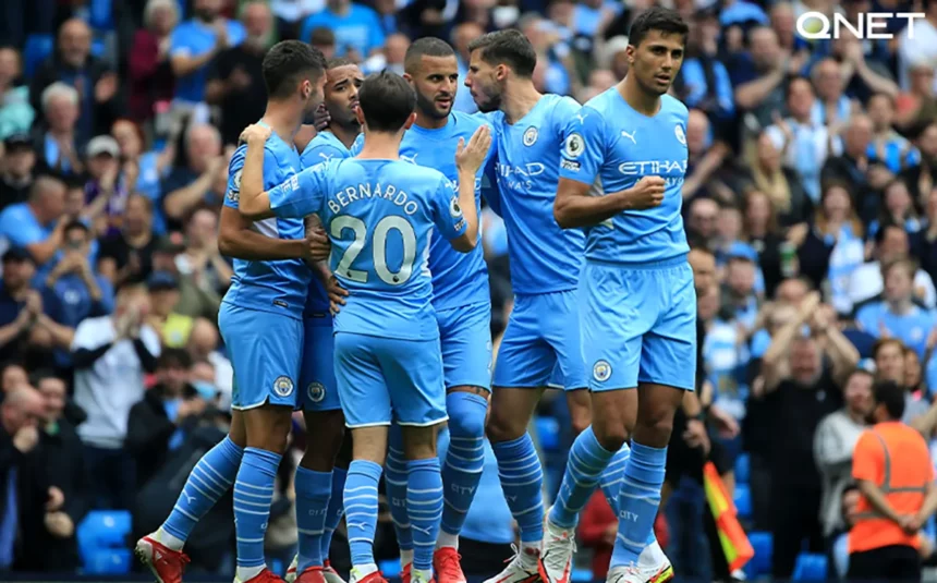 Manchester City players celebrating in the Etihad Stadium after a great start in the Premier League.