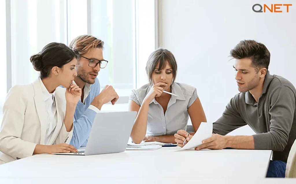 A businessperson pitching ideas to a group of potential customers